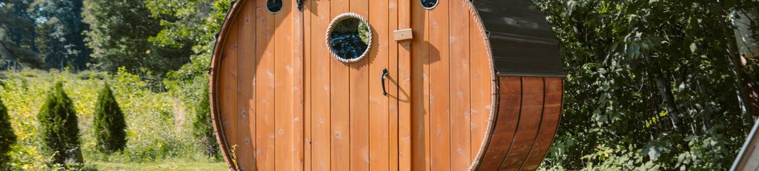 Outdoor barrel sauna in a backyard garden, illustrating permit and zoning considerations for an outdoor sauna