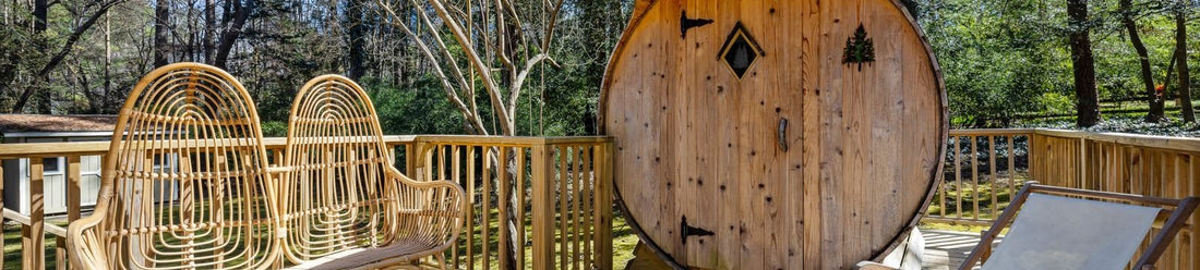 Outdoor wooden barrel sauna in a backyard illustrating the cost to build an outdoor sauna