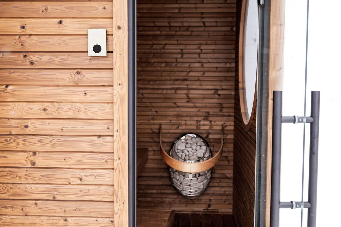 Modular panel sauna with a glass door and cedar-clad walls viewed from the doorway