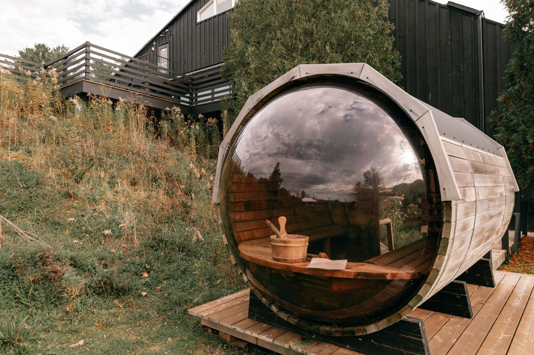 Outdoor wooden barrel sauna in a natural setting