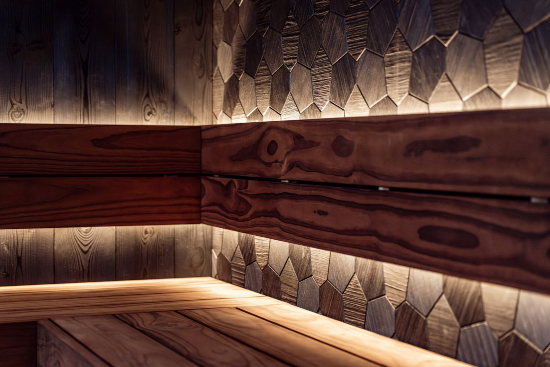 Warm LED lit infrared sauna interior with wooden benches in a home recovery space