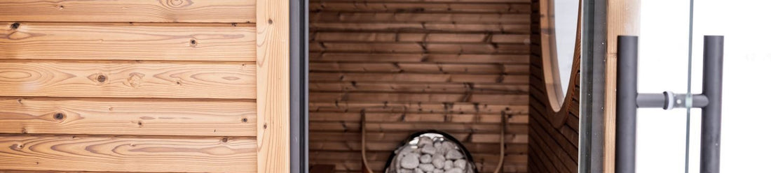 Compact one person infrared sauna interior with a single bench in a wood cabin