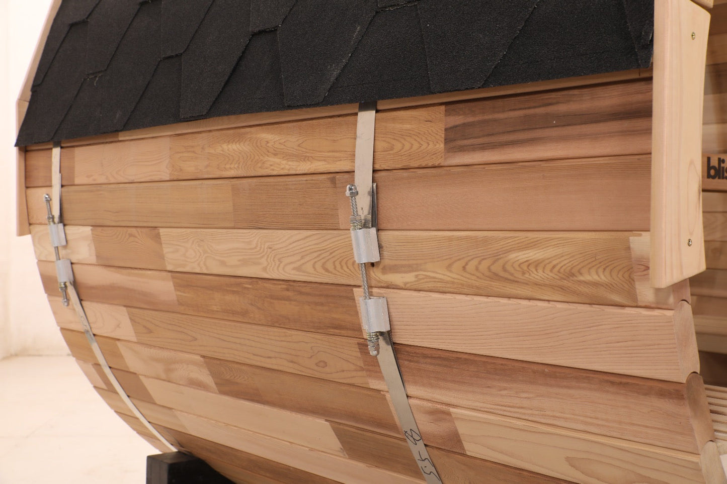 Tensioned steel band and cedar stave detail on the Blisspod Prague barrel sauna