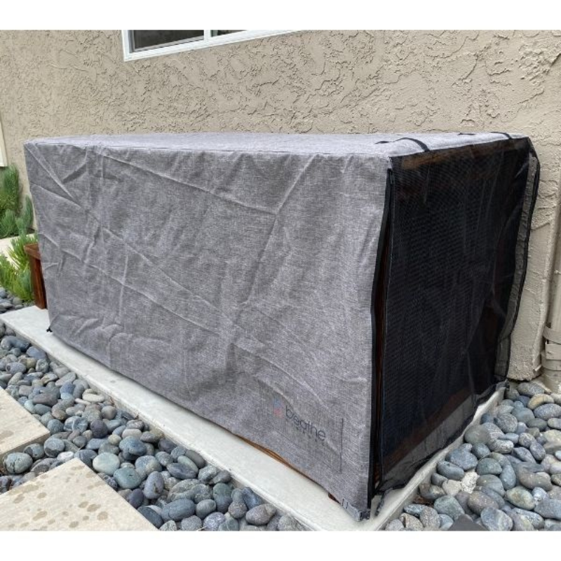 Kooru cold plunge tub fitted with a grey weather cover outdoors