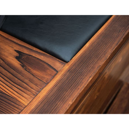 Close detail of the wood grain and insulated lid edge on the Kooru cold plunge tub