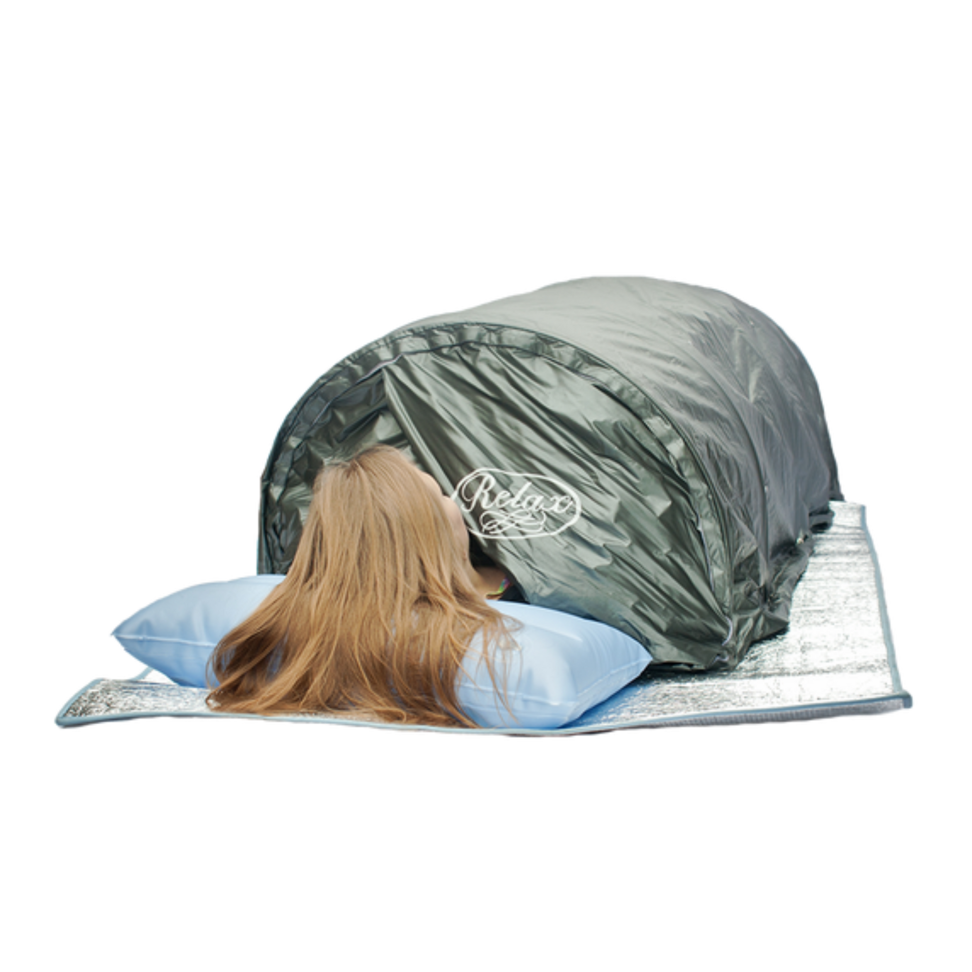 Person lying in the Relax Flex sauna with head resting on a pillow outside the tent
