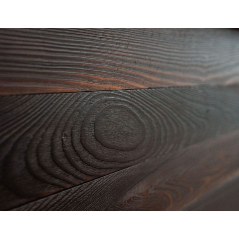 Close detail of the charred wood grain finish on the Kooru cold plunge tub