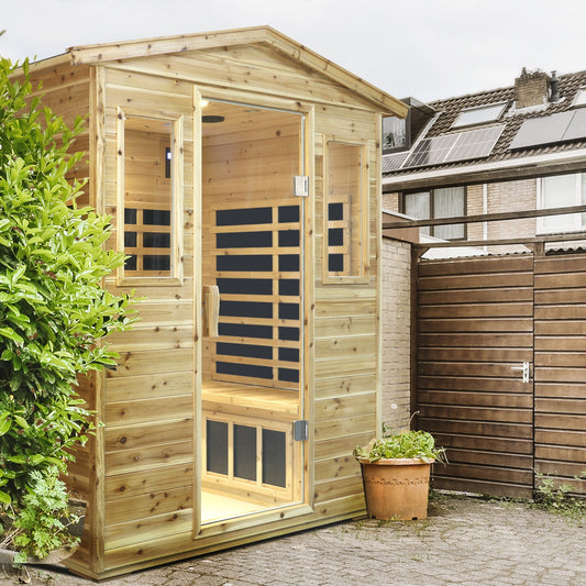 Four person old fir outdoor infrared sauna room installed on a paved patio