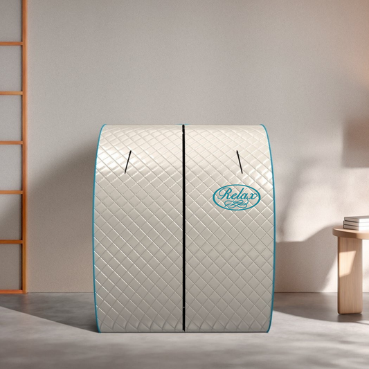 Relax Silver Elite portable far infrared sauna, cream quilted fabric tent with teal trim and Relax logo, set up in a home room