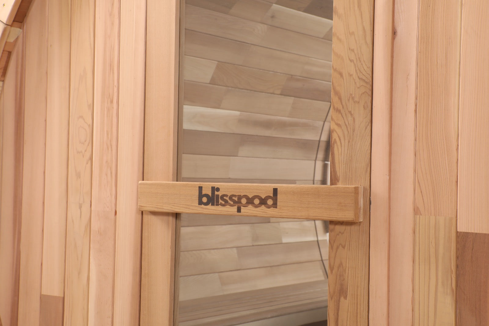 Cedar door handle with the Blisspod name on the Prague barrel sauna