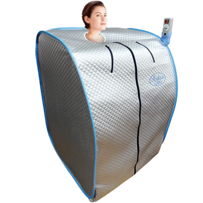 Person seated inside the Relax Silver Elite portable far infrared sauna with head out the top and the handheld controller