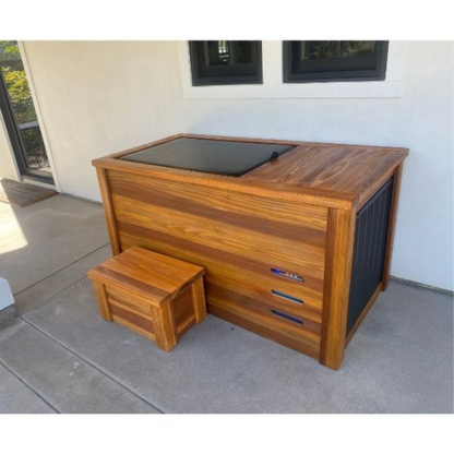 Kooru cold plunge tub in a lighter wood finish on a patio beside a house