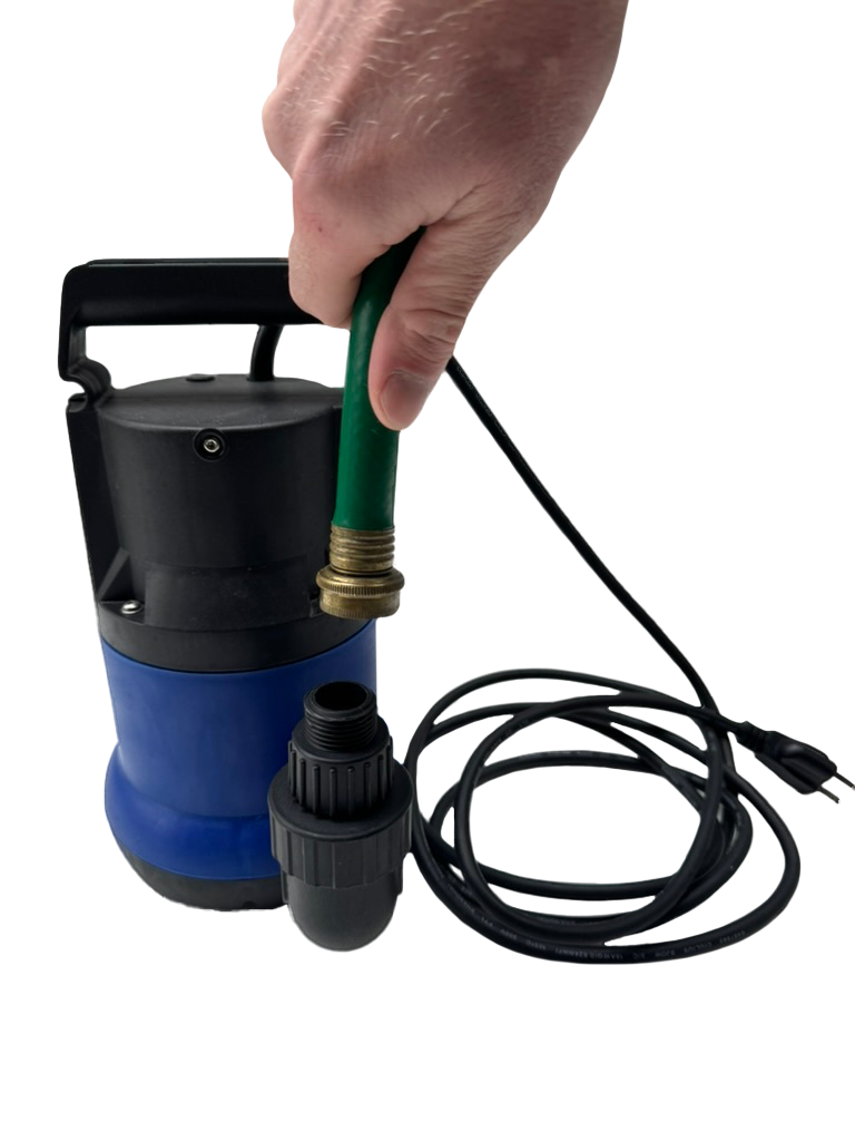 Hand attaching a garden hose to the brass fitting on the RevX drain pump