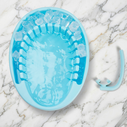 Face Plunge Pure facial cold plunge bowl with ice in the separate ice chamber on a marble countertop