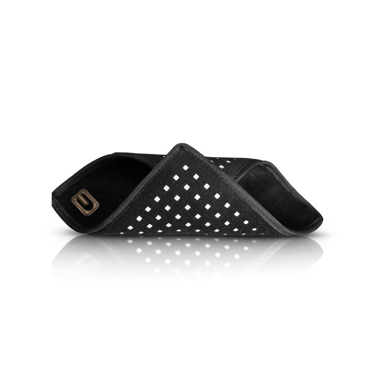 Lumara red light therapy pad shown folded to demonstrate its flexible construction