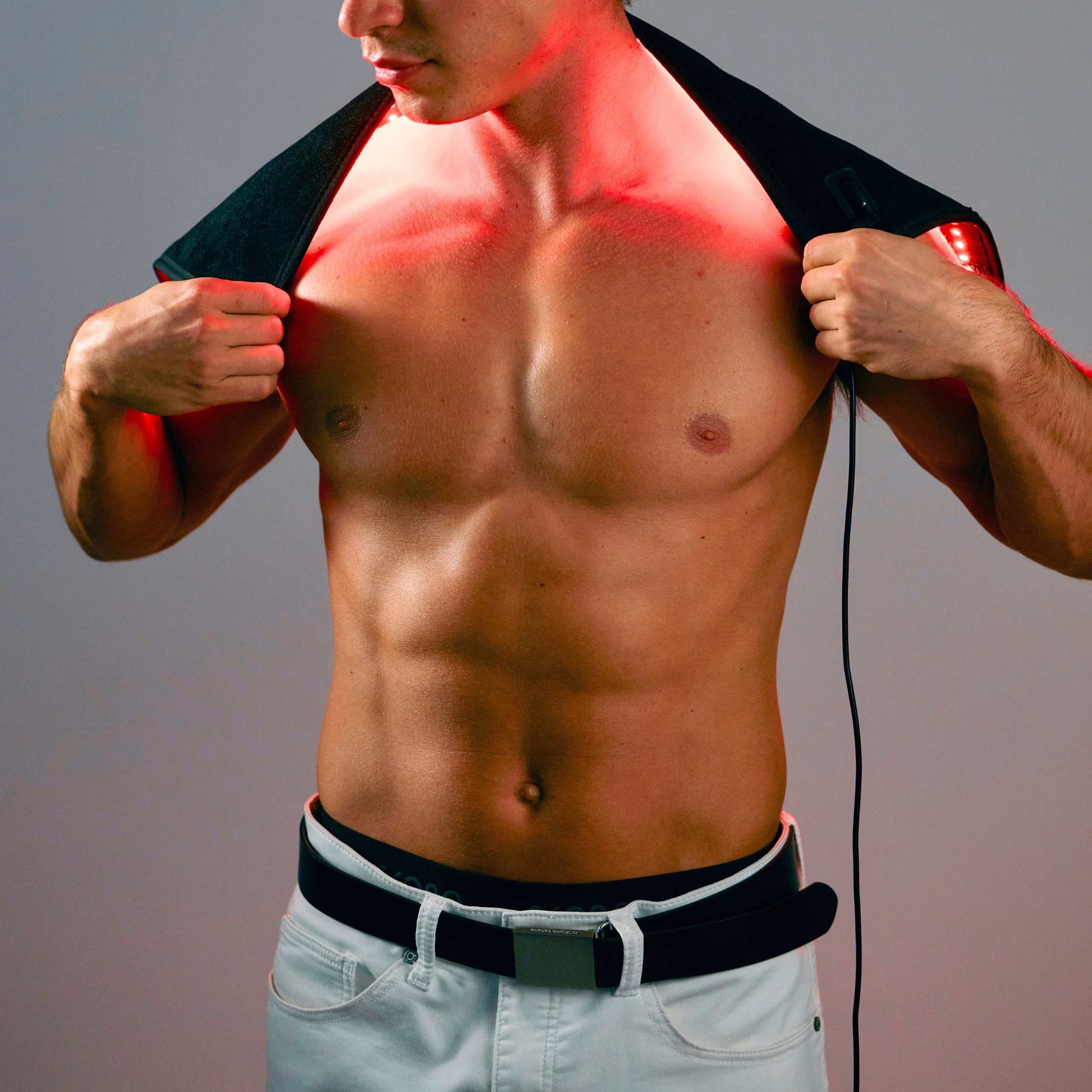 Lumara red light pad worn draped over the shoulders and upper back