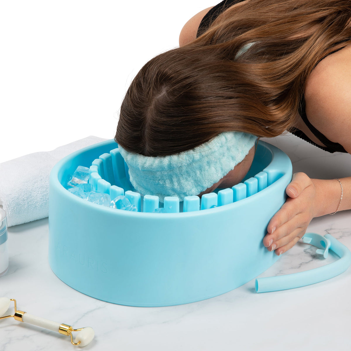 Person using the Face Plunge Pure facial cold plunge bowl