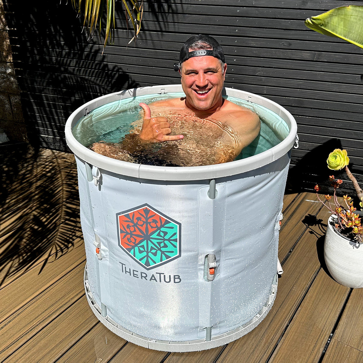 Person using the TheraTub cold plunge outdoors