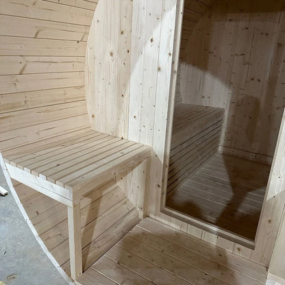 Interior of the red cedar barrel sauna with facing benches