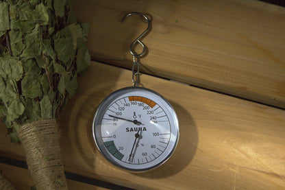 North Shore Sauna wide-range sauna thermometer and hygrometer dial showing temperature in Fahrenheit and Celsius and humidity percent