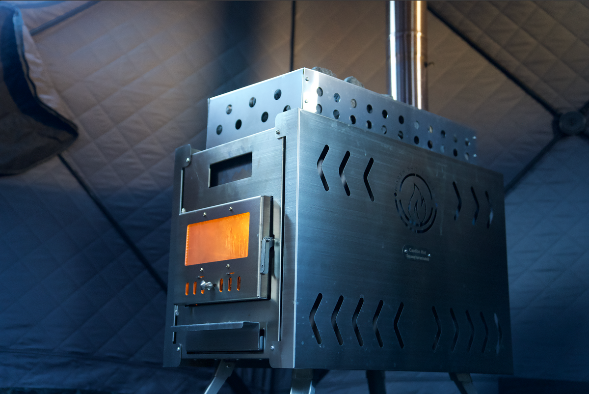 SS304 stainless steel XL sauna tent wood stove with chimney pipe and glowing firebox inside a tent sauna, North Shore Sauna