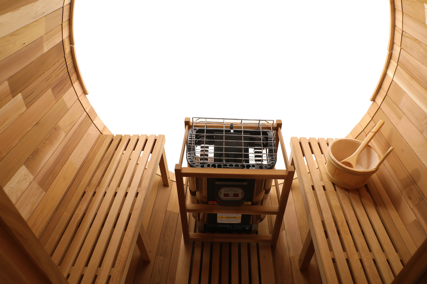 Facing benches and central heater inside the Blisspod Prague barrel sauna