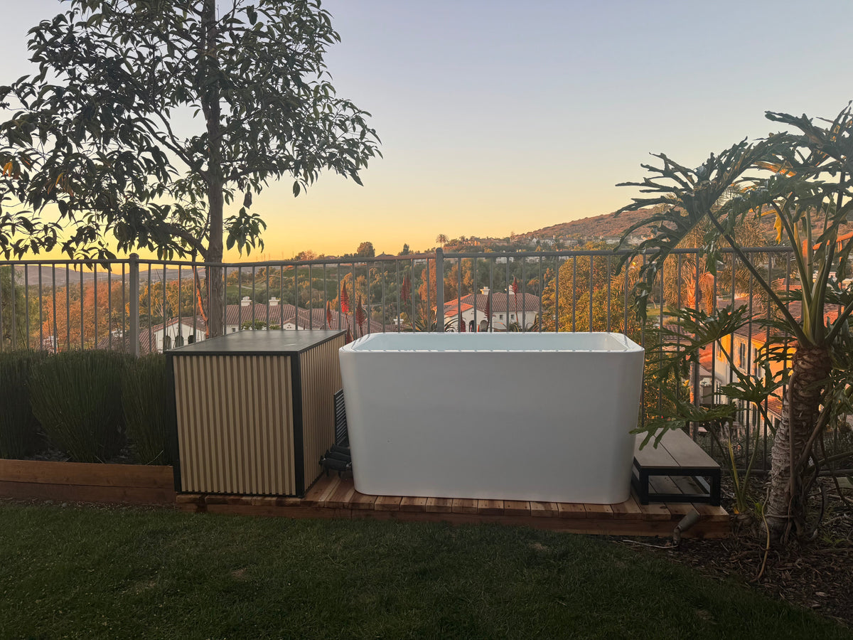 RevX X Tub cold plunge and chiller cabinet on a backyard deck at sunset