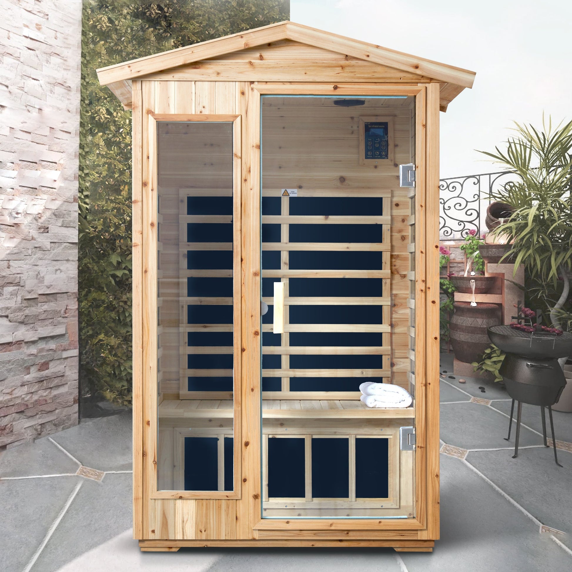 Two person old fir outdoor infrared sauna room on a patio with the door closed