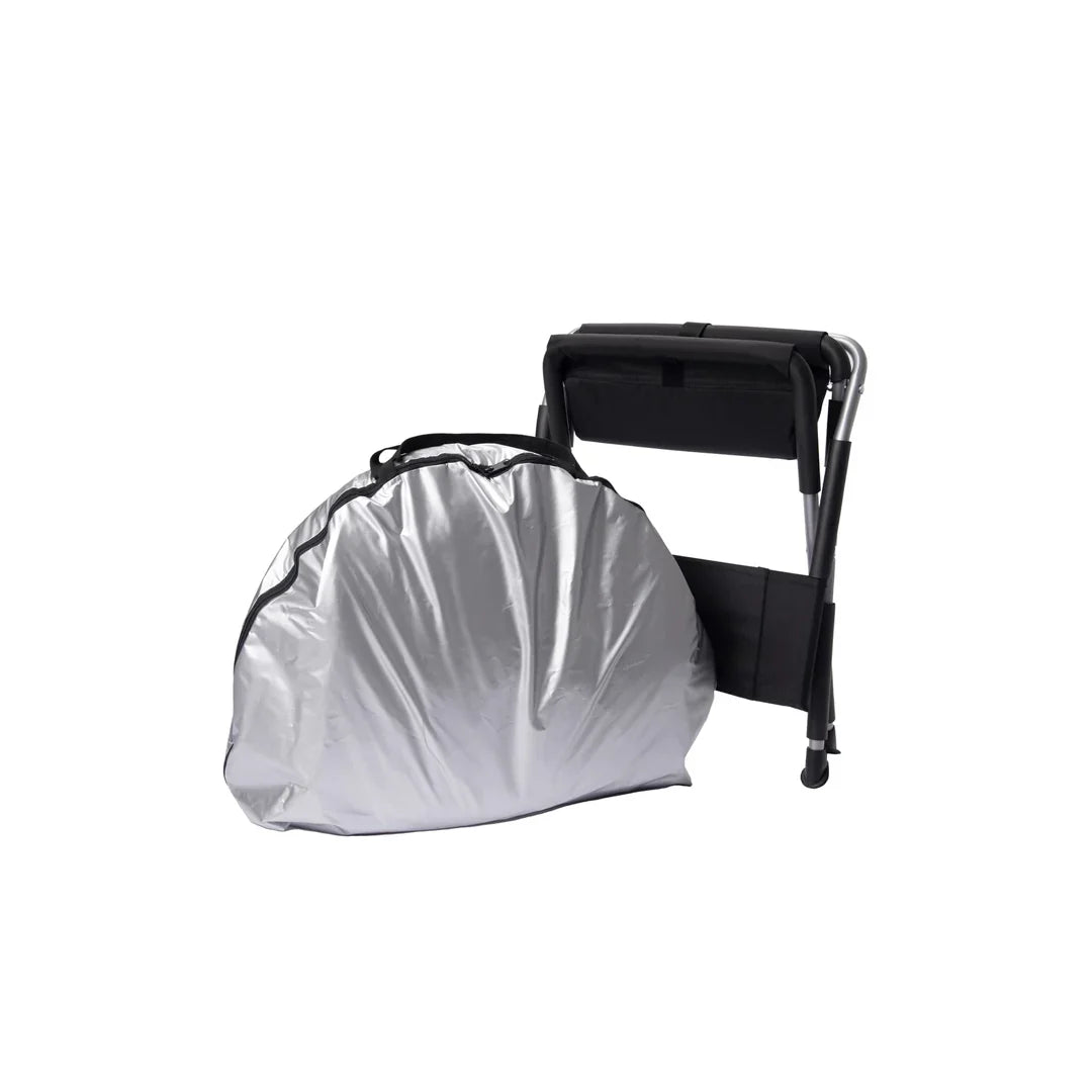 Relax Black Pro sauna packed into its silver carry bag beside the folding chair