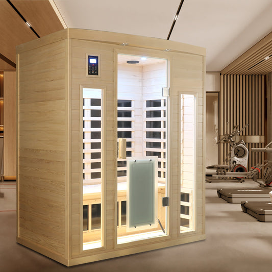 Three person hemlock indoor infrared sauna room installed in a home gym