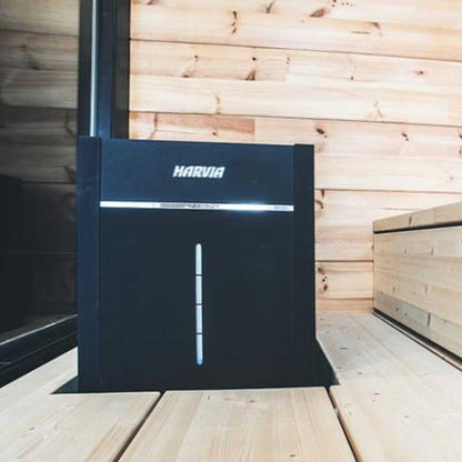 Harvia Virta Combi black sauna heater against a wood panelled wall