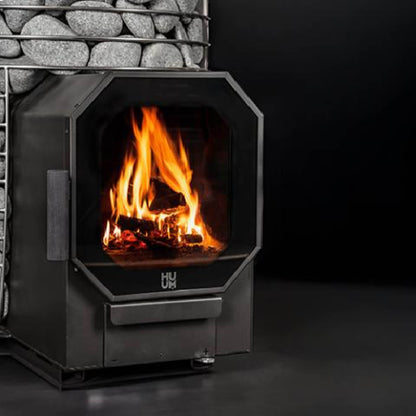 Close view of flames inside the firebox of the Huum Hive Flow Mini stove