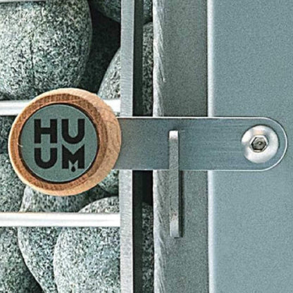 Close view of the Huum badge and extension locking bracket on the Hive Wood LS