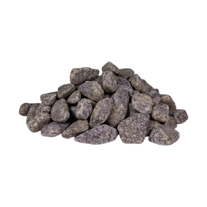 Rounded sauna stones pile on white background