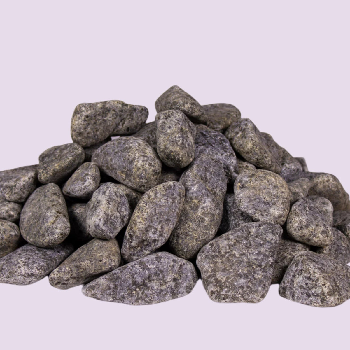 Rounded olivine gabbro sauna stones, pile view