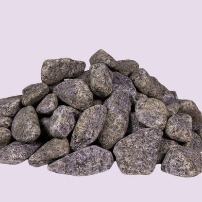 Rounded olivine gabbro sauna stones, pile view