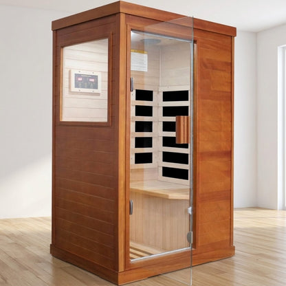 Solid wood 1-person infrared sauna with glass door open in a bright home spa room